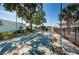 Outdoor shuffleboard courts with mature trees and landscaping in a beautiful community setting at 9214 Mission Oaks Blvd, Seminole, FL 33776