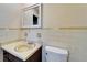 Cozy bathroom featuring sink, toilet and decorative tiling at 1006 Mandalay Dr, Brandon, FL 33511