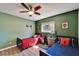 Comfortable bedroom with two twin beds, ceiling fan, and window at 1006 Mandalay Dr, Brandon, FL 33511