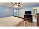 Comfortable bedroom featuring wood floors, closet, dresser and ensuite bathroom at 1006 Mandalay Dr, Brandon, FL 33511