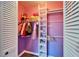 Walk-in closet featuring built-in shelving, hanging rods, and ample storage space at 1006 Mandalay Dr, Brandon, FL 33511