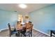 Dining room with a wooden table set for four at 1006 Mandalay Dr, Brandon, FL 33511