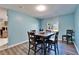 Cozy dining room with wood table, seating for four, and a view to the outside at 1006 Mandalay Dr, Brandon, FL 33511