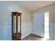 Bright entryway with modern floors, display cabinet and sidelight front door at 1006 Mandalay Dr, Brandon, FL 33511