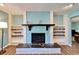 Close-up of the fireplace with decorative mantle and built-in shelving at 1006 Mandalay Dr, Brandon, FL 33511