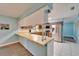 Open kitchen with modern appliances, ample countertop space, and natural lighting at 1006 Mandalay Dr, Brandon, FL 33511