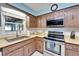 A close up of the kitchen, featuring stainless steel appliances and plentiful cabinet space at 1006 Mandalay Dr, Brandon, FL 33511