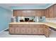 The kitchen offers ample counter space and generous wood cabinet storage at 1006 Mandalay Dr, Brandon, FL 33511