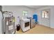 Laundry room features washer and dryer hookups with water heater and access door at 1006 Mandalay Dr, Brandon, FL 33511