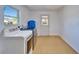 Bright laundry room with modern washer and dryer, window, and access door at 1006 Mandalay Dr, Brandon, FL 33511
