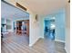 Open-concept living space with light blue walls and modern gray laminate flooring at 1006 Mandalay Dr, Brandon, FL 33511