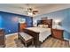 This spacious bedroom has wood floors, a decorative bed frame, and and nightstands at 1006 Mandalay Dr, Brandon, FL 33511