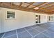 Enclosed patio with overhead light and access to the backyard at 1006 Mandalay Dr, Brandon, FL 33511