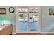 View through sliding glass doors onto the outdoor patio and backyard at 1006 Mandalay Dr, Brandon, FL 33511