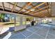 Enclosed patio with ceiling and view of backyard with a partially fenced yard at 1006 Mandalay Dr, Brandon, FL 33511