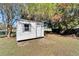 Exterior view of a white shed in the backyard at 1006 Mandalay Dr, Brandon, FL 33511