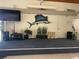 Spacious clubhouse area with TV screen and stage, perfect for community events and gatherings at 10351 Regal Dr # 18, Largo, FL 33774