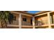 Beige exterior features decorative railings and balconies with a palm tree in the foreground at 10351 Regal Dr # 18, Largo, FL 33774