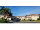 Spacious condos with ample parking, lush tropical landscaping, and beautiful blue skies overhead at 10351 Regal Dr # 18, Largo, FL 33774