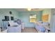 Bright, clean on-site laundry room equipped with multiple washers and dryers for residents at 10351 Regal Dr # 18, Largo, FL 33774