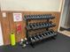 A well-equipped weight room featuring multiple sets of dumbbells on a rack for convenient access during workouts at 10351 Regal Dr # 18, Largo, FL 33774