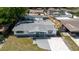 Aerial view of the home in the community with a pool, shed, and fenced-in yard at 10686 110Th Ln, Largo, FL 33778