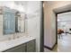 Stylish bathroom with a gray vanity, modern fixtures, and decorative accent tile at 10686 110Th Ln, Largo, FL 33778