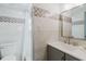 Modern bathroom with patterned tile accents, sleek fixtures, and a walk-in shower at 10686 110Th Ln, Largo, FL 33778