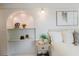 Charming bedroom with decorative shelving, a side table, and neutral tones at 10686 110Th Ln, Largo, FL 33778