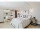 Bedroom with mirrored closet and decorative nook with side table at 10686 110Th Ln, Largo, FL 33778