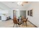 Open-concept dining area with modern furnishings and adjacent kitchen at 10686 110Th Ln, Largo, FL 33778