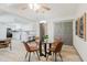 Open-concept dining area with modern furnishings and adjacent kitchen at 10686 110Th Ln, Largo, FL 33778