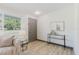 Bright entryway with a modern door, stylish side table, and a glimpse of the comfortable living room at 10686 110Th Ln, Largo, FL 33778
