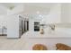 Bright kitchen featuring white cabinets, stainless steel appliances, and quartz countertops at 10686 110Th Ln, Largo, FL 33778