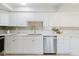 Bright kitchen featuring white cabinets, stainless steel appliances, and quartz countertops at 10686 110Th Ln, Largo, FL 33778