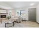 Inviting living room featuring a stone fireplace, neutral sofa, and modern decor at 10686 110Th Ln, Largo, FL 33778