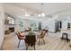 Open living space features a stone fireplace and an open floor plan to the updated kitchen at 10686 110Th Ln, Largo, FL 33778