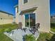 Back patio area with seating, perfect for enjoying the outdoors at 10727 Penny Gale Loop, San Antonio, FL 33576