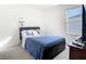 Bright bedroom features plush carpet, a ceiling fan, and a window with blinds at 10727 Penny Gale Loop, San Antonio, FL 33576