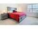 Inviting bedroom with plush carpet and a window with blinds at 10727 Penny Gale Loop, San Antonio, FL 33576