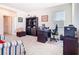 Bright home office featuring a desk, chair, bookcase, and comfortable seating area, perfect for remote work at 10727 Penny Gale Loop, San Antonio, FL 33576