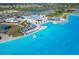 Aerial view of a lagoon with beach access and lounge seating, offering a relaxing waterfront experience at 10727 Penny Gale Loop, San Antonio, FL 33576