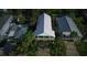 Aerial view of home showcasing backyard deck and lush landscaping at 112 13Th Ave, Indian Rocks Beach, FL 33785