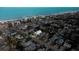 Aerial view of coastal home near the beach, with lush trees and nearby city amenities at 112 13Th Ave, Indian Rocks Beach, FL 33785