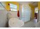 Bright modern bathroom with white soaking tub, walk-in glass block divider at 112 13Th Ave, Indian Rocks Beach, FL 33785