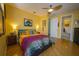 Bedroom with bright walls and wood floors provides lots of space and natural light at 112 13Th Ave, Indian Rocks Beach, FL 33785