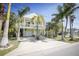 Charming two-story coastal home featuring a spacious balcony and lush landscaping at 112 13Th Ave, Indian Rocks Beach, FL 33785