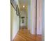 Hallway features hardwood floors and neutral-colored walls that offer access to other areas of the home at 112 13Th Ave, Indian Rocks Beach, FL 33785