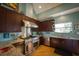 Beautiful kitchen with stainless steel appliances, wooden cabinets, backsplash, and hardwood flooring, perfect for cooking at 112 13Th Ave, Indian Rocks Beach, FL 33785