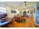 Bright living room features hardwood floors, art, and comfortable seating for entertaining and relaxation at 112 13Th Ave, Indian Rocks Beach, FL 33785